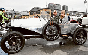 Classic cars line the harbour
